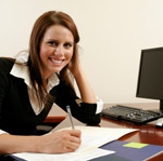 woman smiling at computer